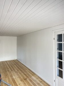 Bright room with wooden floor and white walls