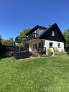 Modern two-story house with wooden deck